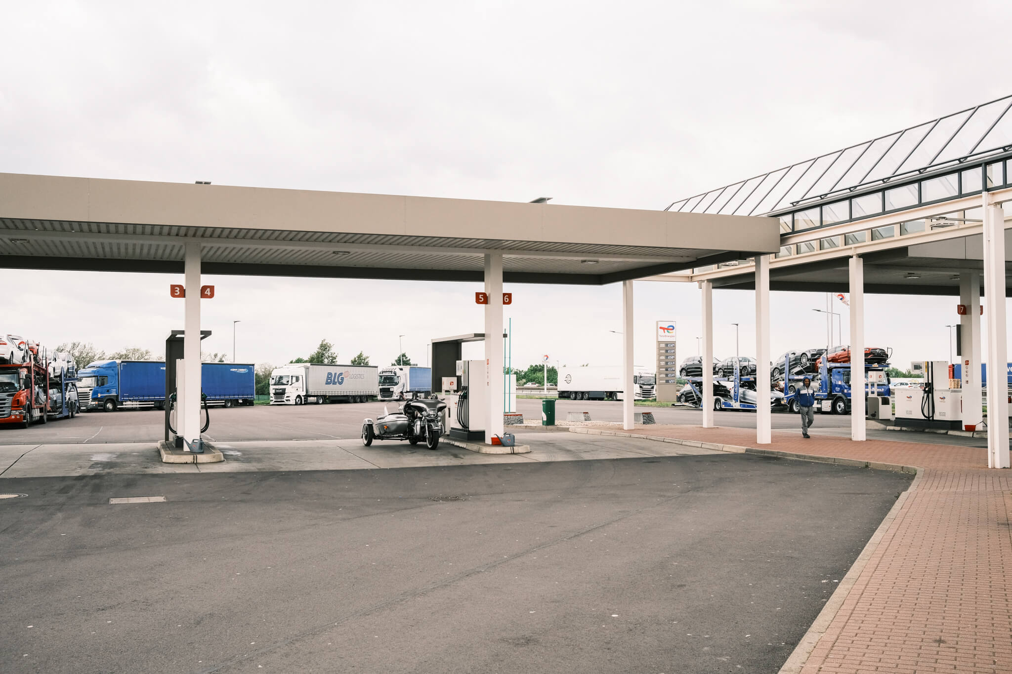 a motocycle is parked at a gas station on the way to Berlin, Germany