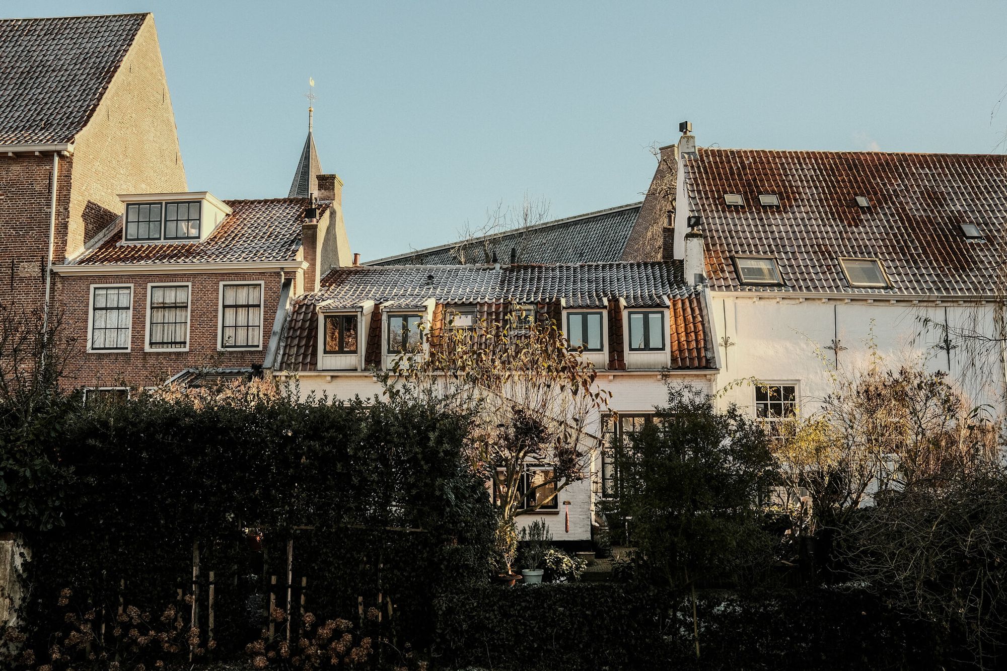 The old houses of Muurhuizen, photographed from across the canal they are situated on.