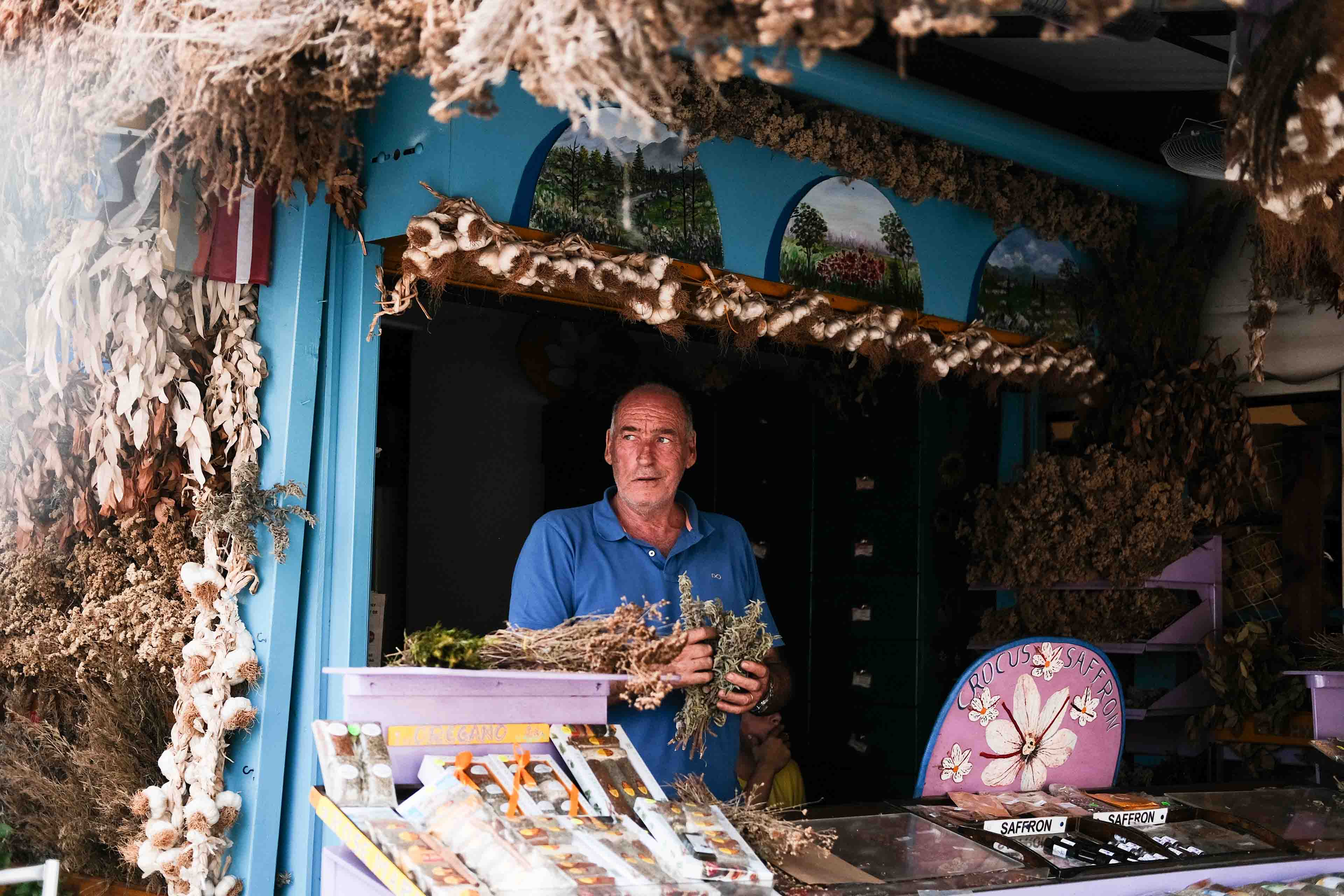 a man in Greece selling vegetables