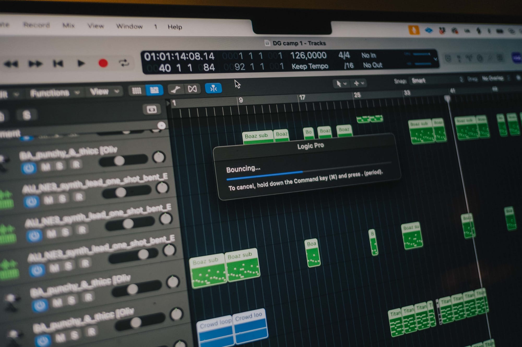 a close up of a computer screen that displays Logic Pro while exporting (called 'Bouncing') a song